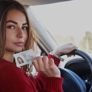 Girl showing their driving licence