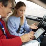 Driving instructor guiding student during SAAQ driving lesson practice in Quebec