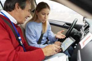 Driving instructor guiding student during SAAQ driving lesson practice in Quebec